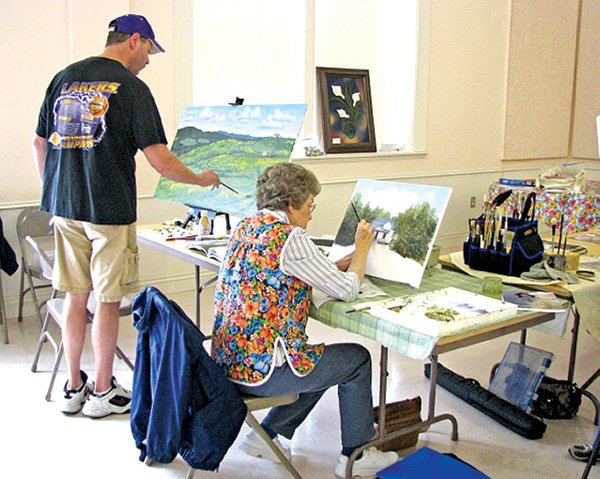 Students paint at the Leslie Shupe Art School in Rogers. The art school is held twice a year at First Presbyterian Church in Rogers.