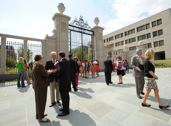 A crowd gathers Friday in front of the Pi Beta Phi Centennial Gate on the University of Arkansas campus in Fayetteville during a dedication ceremony for the structure. About 300 people attended the event. Video is available at arkansasonline.com/videos. 