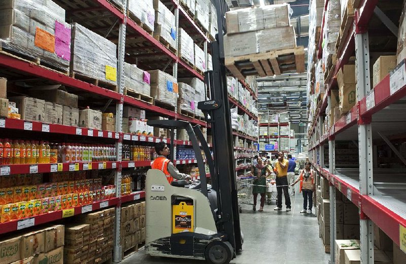 A forklift operator works at a Bharti Wal-Mart wholesale store in Zirakpur, in northern India. Wal-Mart Stores Inc. has announced plans to open retail stores in India, capitalizing on the government’s recent decision to open retail markets to majority ownership by foreign companies. 
