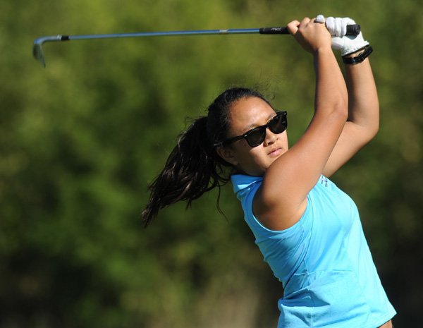 Har-Ber’ junior Jodie Karsono watches her tee shot sail to the green on No. 3 Tuesday during play in Fayetteville.