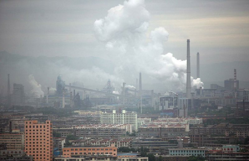Emissions from a coal-fired power plant fill the air in Taiyuan, Shanxi, China. Foxconn Technology said Monday that it closed one of its huge plants in Taiyuan after a riot in an employee dormitory. 