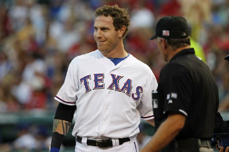 Texas outfielder Josh Hamilton returned to the Rangers’ lineup Monday night after missing five consecutive games because of a cornea problem. 