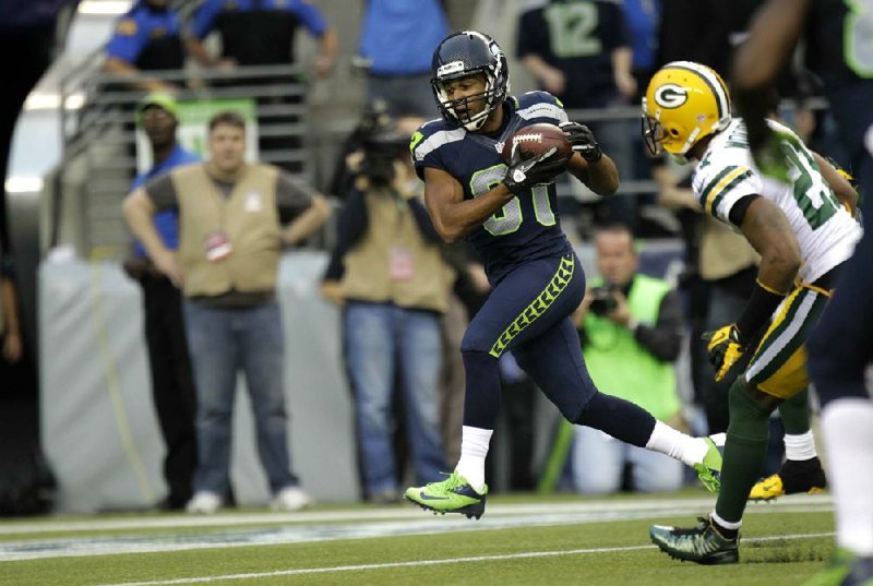 Seattle Seahawks wide receiver Golden Tate (left) catches the first of his two touchdowns during Monday’s game against the Green Bay Packers. Tate’s second touchdown was more controversial, coming on a last-second Hail Mary from Russell Wilson. 