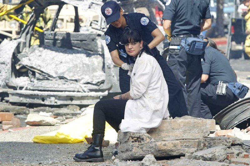 Abby (Pauley Perrette) gets medical attention following a bomb blast at headquarters. NCIS, TV’s top drama, kicks off Season 10 at 7 p.m. today on CBS. 