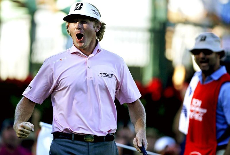 Brandt Snedeker celebrates after sinking his putt on the 18th hole to win the Tour Championship, the FedEx Cup and the $10 million bonus that comes with it on Sunday in Atlanta. 