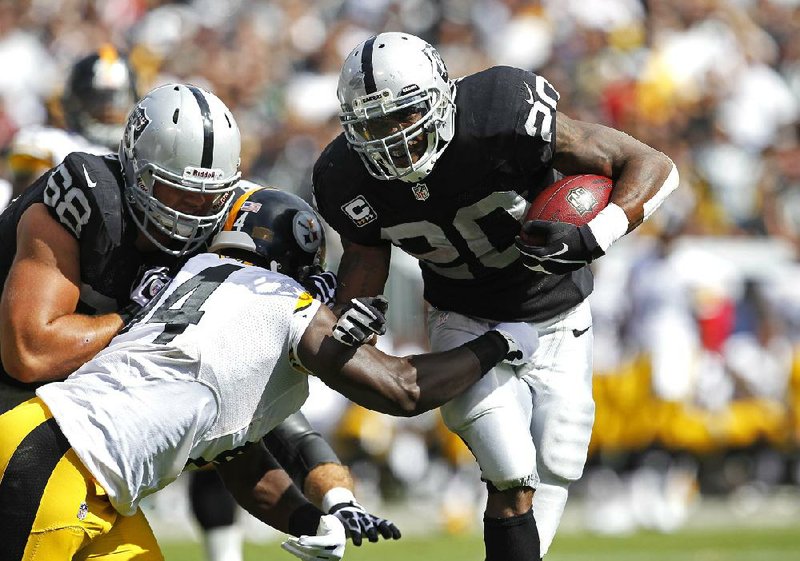 Oakland Raiders running back Darren McFadden (right) ran for 113 yards on 18 carries and 1 touchdown on Sunday afternoon against the Pittsburgh Steelers in Oakland, Calif. The Raiders beat the Steelers 34-31.


