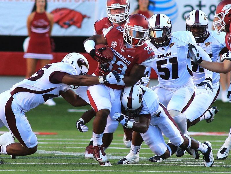 Running back Dennis Johnson (33) is one of three Arkansas running backs to have no negative-yard carries this season. Ronnie Wingo and Jonathan Williams are the others. 