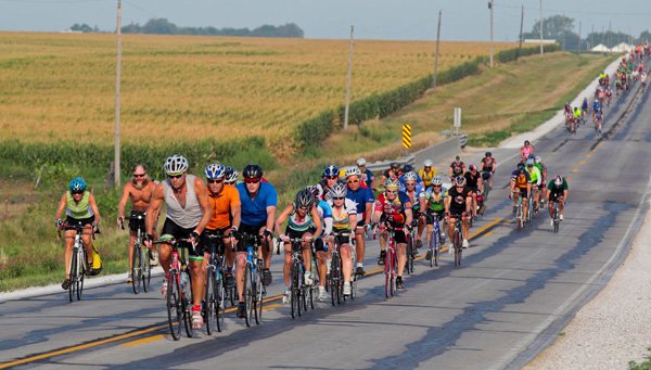Riders steer their bikes — the kind with pedals — across Iowa during the annual RAGBRAI bicycle ride. About 12,000 cyclists take part in the weeklong ride, making RAGBRAI the largest group bicycle ride in the world.