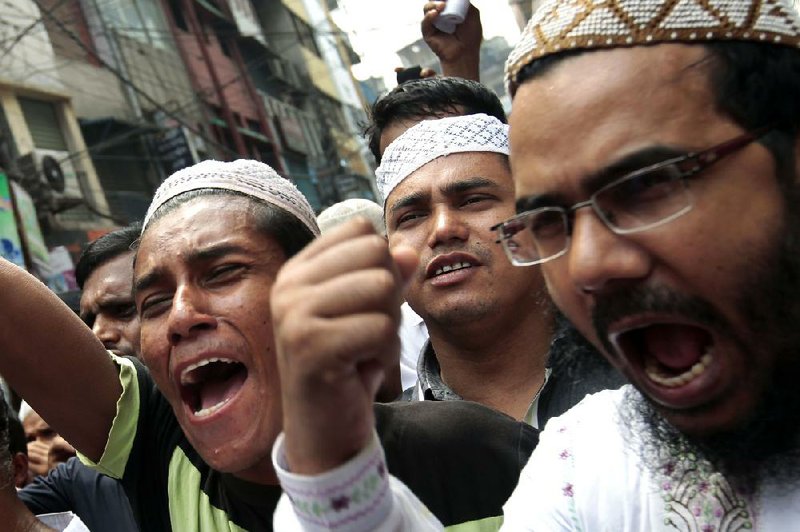 Supporters of Dhaka Bashi, a social-welfare organization, march Wednesday in Dhaka, Bangladesh, at a protest against the film Innocence of Muslims, which ridicules Islam’s Prophet Muhammad. 