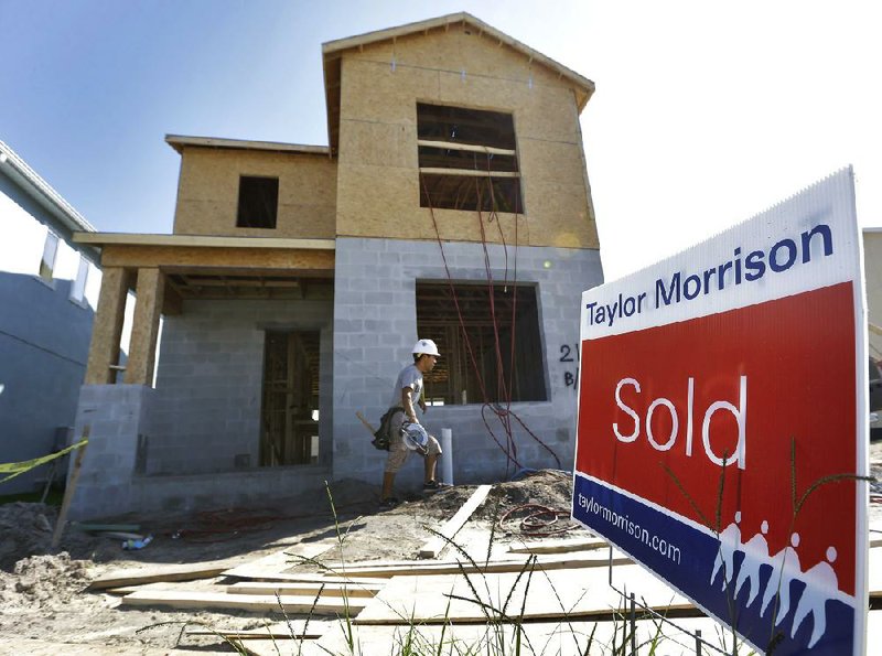 A builder works on a new house at the Winthrop subdivision in Riverview, Fla., on Wednesday. Sales of new homes in the United States dipped 0.3 percent in August, the Commerce Department said Wednesday. 