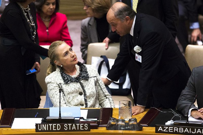 Secretary of State Hillary Rodham Clinton and French Foreign Minister Laurent Fabius chat before a U.N. Security Council meeting Wednesday at U.N. headquarters in New York. 