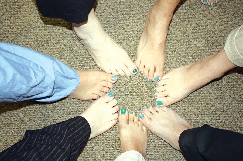 Some of the employees at Harris Hospital in Newport show off their teal toes. The women painted their toenails teal to help raise awareness of ovarian cancer.