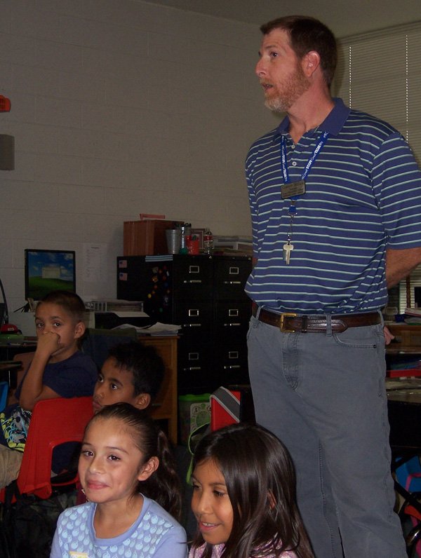 Cameron McCain, third-grade teacher at Jones Elementary School, talks Wednesday to students about math concepts. McCain is one of five teachers at Jones who follows students through two grade levels.