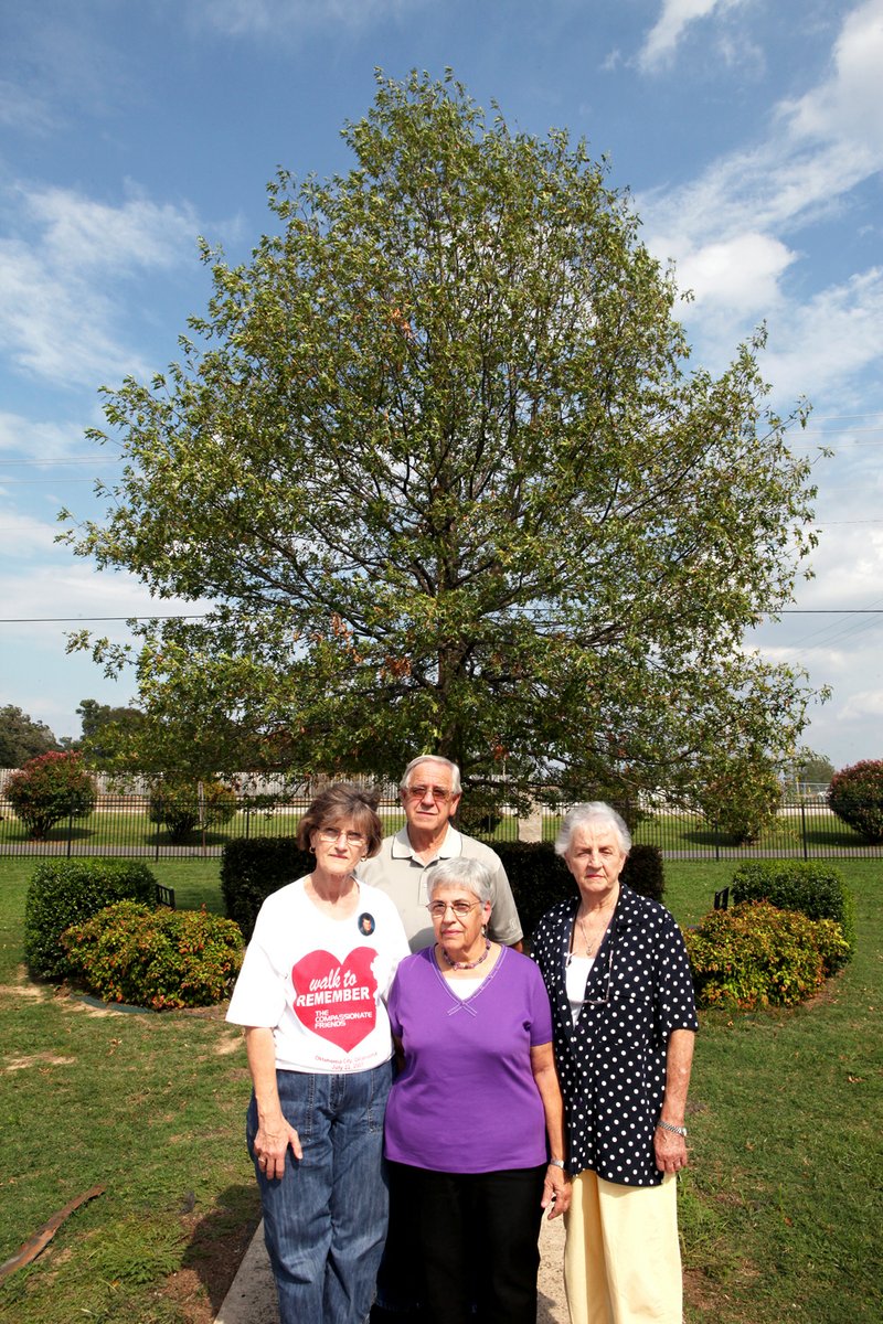 From the left, Connie Davis, Bob Davis, Patty Cesarski and Sissy Thomas are involved with The Compassionate Friends of Independence County. The group, which helps parents who have lost a child, planted a memorial tree at Riverside Park in Batesville. 