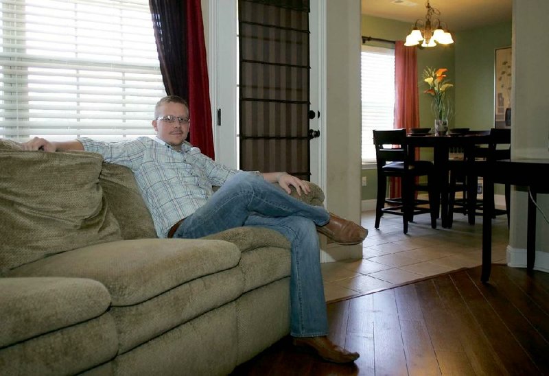 Joe Payne at his Personal Space on the couch in the living room of his families home in Rogers.