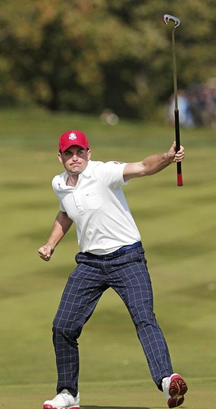 Keegan Bradley celebrates a birdie putt on the eighth hole during a four-ball match Friday in Ryder Cup play. 
