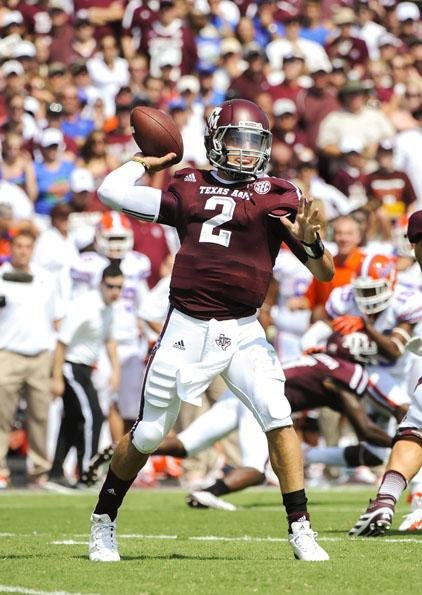  Texas A&M quarterback Johnny Manziel vs. the Arkansas defense
Manziel (above) has plenty of teammates to hand the ball or pass the ball to, but he’s been an effective runner, and has emerged as the focal point of the Aggies’ offense under Kevin Sumlin and coordinator Kliff Kingsbury. 
