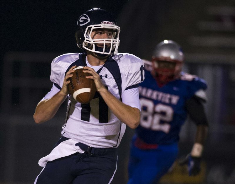Greenwood quarterback Jabe Burgess looks to pass during Friday night’s game against Little Rock Parkview at War Eagle Field in Little Rock. 