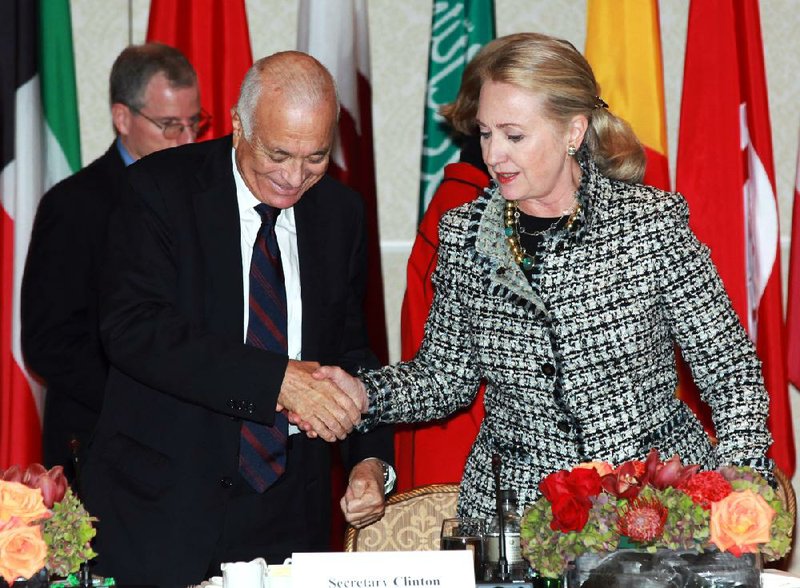 Secretary of State Hillary Rodham Clinton greets Arab League head Nabil Elaraby at a Friends of Syria gathering Friday in New York. 