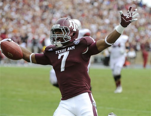Texas A&M cornerback Tramain Jacobs celebrates scoring on a turnover by Arkansas running back Knile Davis during the third quarter of a SEC football game Saturday, Sept. 29, 2012, in College Station, Texas. (AP Photo/Pat Sullivan) 