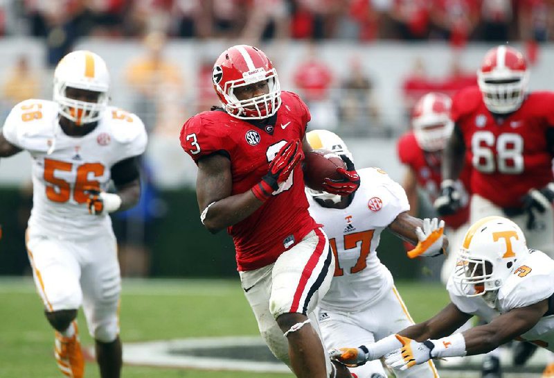 Georgia running back Todd Gurley (center) ran 24 times for 131 yards and 3 touchdowns in the Bulldogs’ 51-44 victory over Tennessee Saturday afternoon at Sanford Stadium in Athens, Ga. 