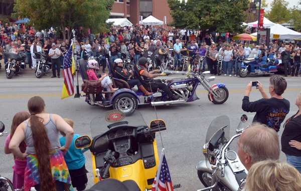 Participants in the parade cruise down Dickson Street on Saturday afternoon as they end the parade in Fayetteville. The annual parade for Bikes Blues & BBQ is the largest bike parade in Arkansas. 