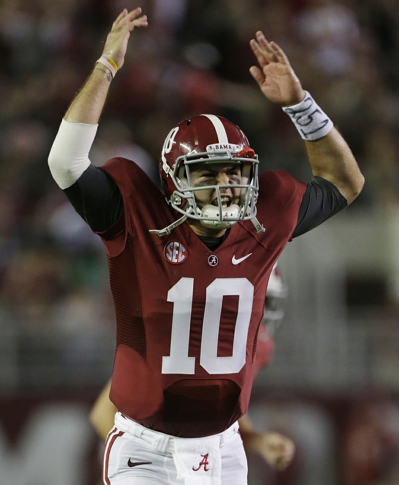 Alabama quarterback AJ McCarron (10) celebrates after throwing a touchdown in the first half of Saturday’s game against Mississippi at Bryant-Denny Stadium in Tuscaloosa, Ala. The top-ranked Crimson Tide won 33-14. 