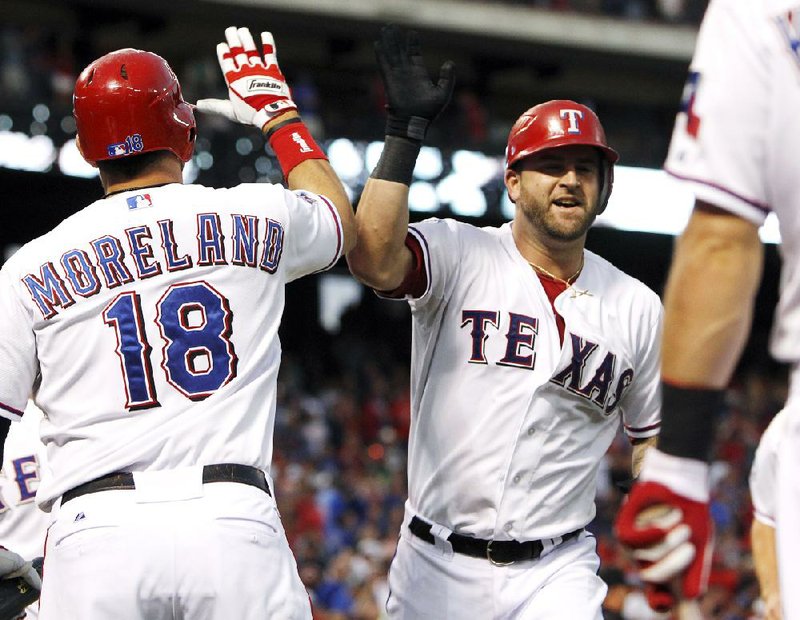 Mike Napoli homers as Rangers top Tigers, return home in playoff
