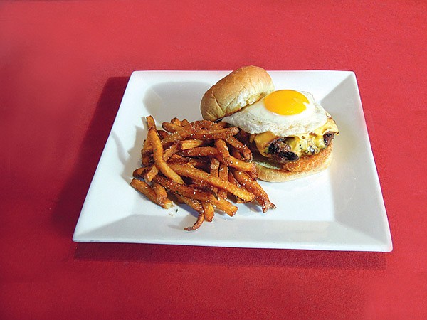 The Hangover Burger is a staple at Farrell's. It tops a crisp hashbrown with a hand-patted Angus beef burger, American cheese, bacon and an over-easy egg.