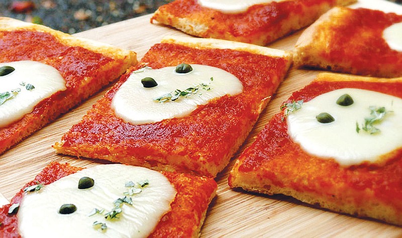 Alien Pizza Squares provide a fun — and ghoulish — twist to feeding your children and their friends for a Halloween gathering.