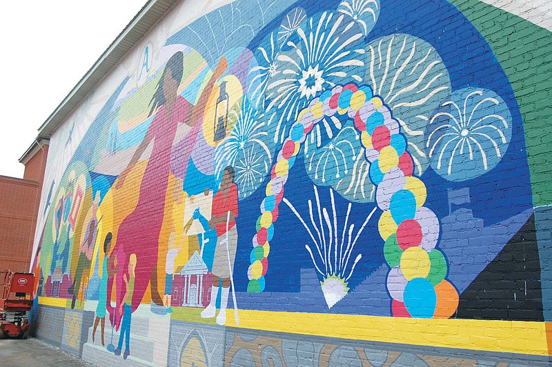 This mural on the Honeycomb Restaurant in Arkadelphia is dominated by the figure of a woman. She symbolizes a mother or teacher who inspires and encourages young people. She beckons them with one hand while holding the light of knowledge and learning with the other hand.