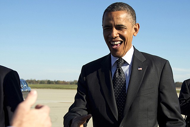 President Barack Obama arrives Tuesday at the airport in Columbus, Ohio, for a campaign event at Ohio State University, where he urged students to register to vote before the Tuesday night deadline and to vote early. 