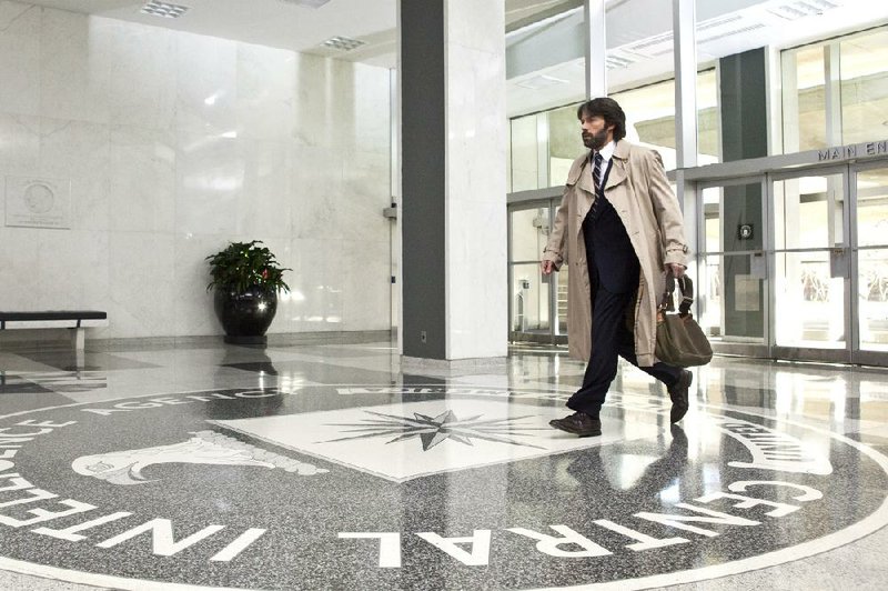 Tony Mendez (Ben Affleck), a CIA “exfiltration” expert who specializes in getting people out of tough spots, arrives at headquarters in the based-on-a-true-story film Argo. 