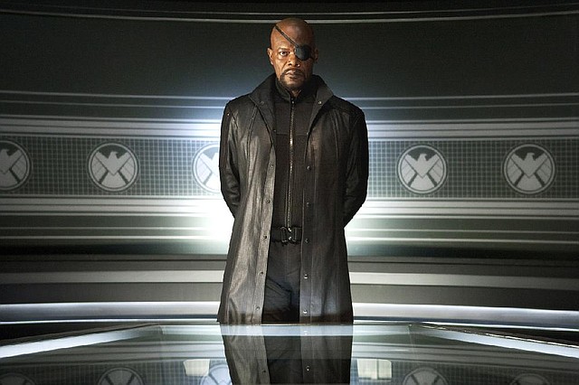 S.H.I.E.L.D. director Nick Fury (Samuel L. Jackson) assembles a group of superheroes to defend the world from an extraterrestrial Norse deity in The Avengers. 