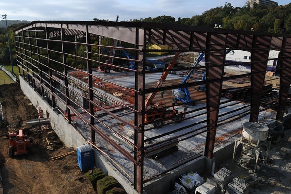 Construction continues on the indoor practice facility Thursday next to Harmon Stadium at Fayetteville High School. The district is renovating and building athletic facilities. 