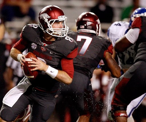 NWA Media/JASON IVESTER -- Arkansas quarterback Tyler Wilson rolls out of the pocket to pass against Kentucky during the second quarter on Saturday, Oct. 13, 2012, at Donald W. Reynolds Razorback Stadium in Fayetteville.