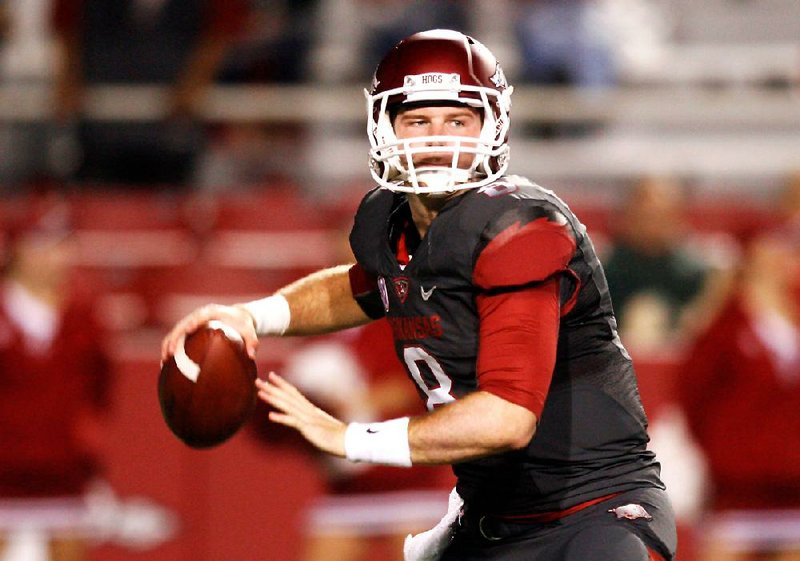 Arkansas quarterback Tyler Wilson completed 23 of 31 passes for 372 yards and tied a school record with 5 touchdowns during Saturday’s weather-shortened victory over Kentucky. 