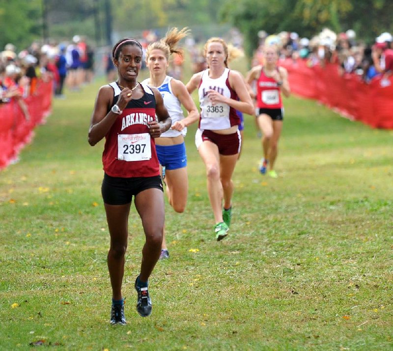 Arkansas’ Semehar Tesfaye crosses the finish line after finishing fifth in the 6,000-meter race at the Chilie Pepper Cross Country Festival in Fayetteville. Tesfaye finished in 21 minutes, 6.4 seconds to help the Razorbacks win the team title with 58 points. 