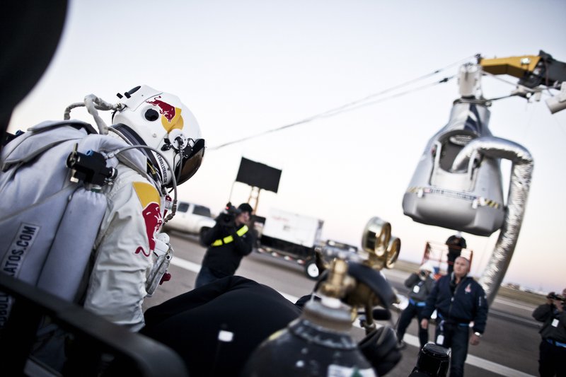 In this photo provided by Red Bull, Pilot Felix Baumgartner of Austria steps out from his trailer during the final manned flight for Red Bull Stratos in Roswell, N.M. on Saturday, Oct. 14, 2012. Baumgartner plans to jump from an altitude of 120,000 feet, an altitude chosen to enable him to achieve Mach 1 in free fall, which would deliver scientific data to the aerospace community about human survival from high altitudes.