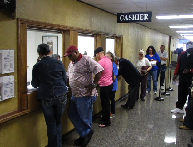  A line of last-day tax payers gathers at the Pulaski County treasurer's office Monday.