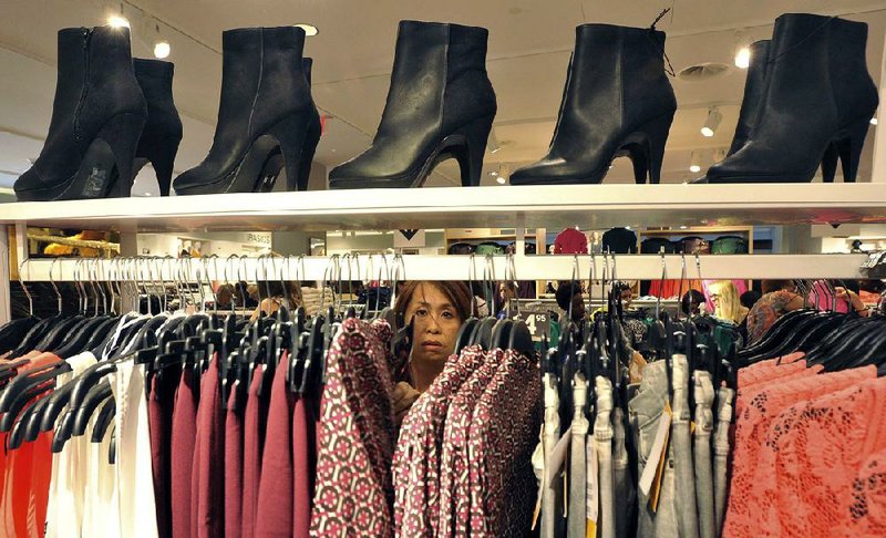 A woman shops at The Avenues Mall in Jacksonville, Fla., in this Sept. 6 photo. Economists say the gains in retail sales in August and September could bring stronger economic growth for the second half of the year. 