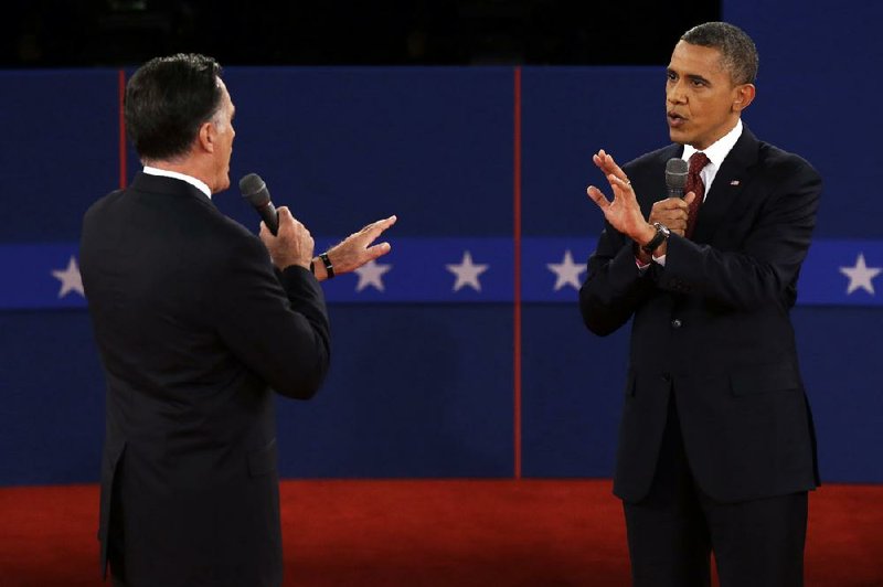 Republican presidential nominee Mitt Romney  and President Barack Obama spar over energy policy during the second presidential debate at Hofstra University, Tuesday, Oct. 16, 2012, in Hempstead, N.Y. (AP Photo/Charlie Neibergall)