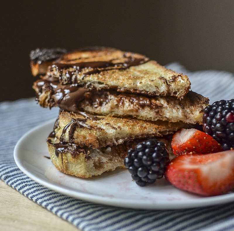 Nutella and cream cheese meld together for this decadent dessert sandwich on thinly sliced Italian bread.