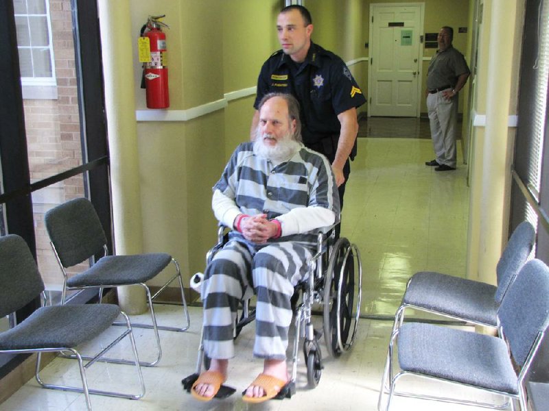 Richard Conte, seen here being wheeled from a courtroom after a hearing, has been found competent to stand trial in the 2002 killings of two men at a Conway home. 