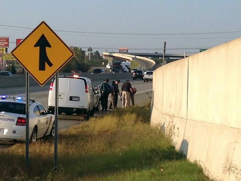Police are investigating Wednesday, Oct. 24, 2012, after a body was found on the side of U.S. 67/167 in North Little Rock.
