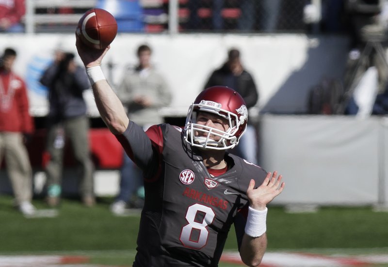 Arkansas quarterback Tyler Wilson passes during the first half of an NCAA college football game against Mississippi in Little Rock, Ark., Saturday, Oct. 27, 2012. 