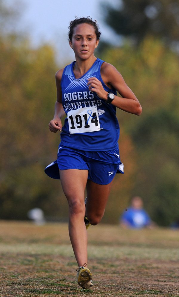 Maggie Montoya of Rogers High wins the Mountie Classic on Tuesday at Rogers. Montoya, who ran the race in 18:09.7, set a course record. 