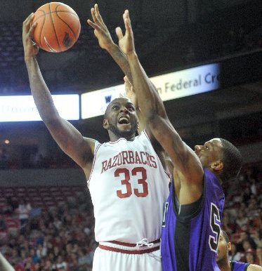 NWA Media/ MICHAEL WOODS --11/02/2012 -- University of Arkansas forward Marshawn Powell goes up for a lay up over Southwest Baptist defender Jaywuan Hill as he drives to the hoop in the first half of Friday night's game at Bud Walton Arena in Fayetteville.