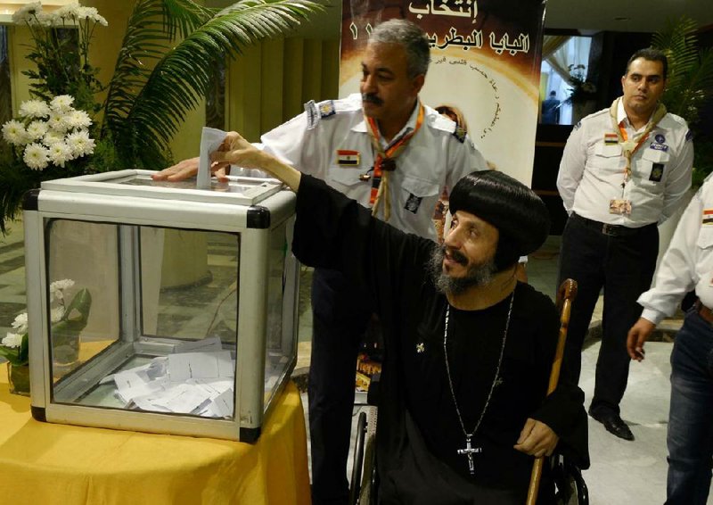 Coptic clergymen, including this man, gathered Monday to cast votes for the next pope of the Coptic Orthodox Church. The winner will be announced Sunday. 