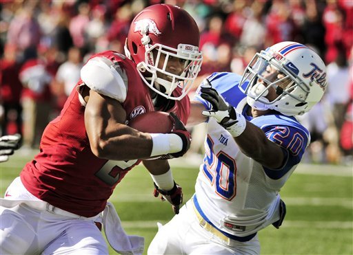Arkansas wide receiver Julian Horton (2) tries to get around Tulsa defensive back Marco Nelson (20) during the first quarter of an NCAA college football game in Fayetteville, Ark., Saturday, Nov. 3, 2012. (AP Photo/April L. Brown)